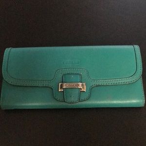 Coach wallet in a dark turquoise